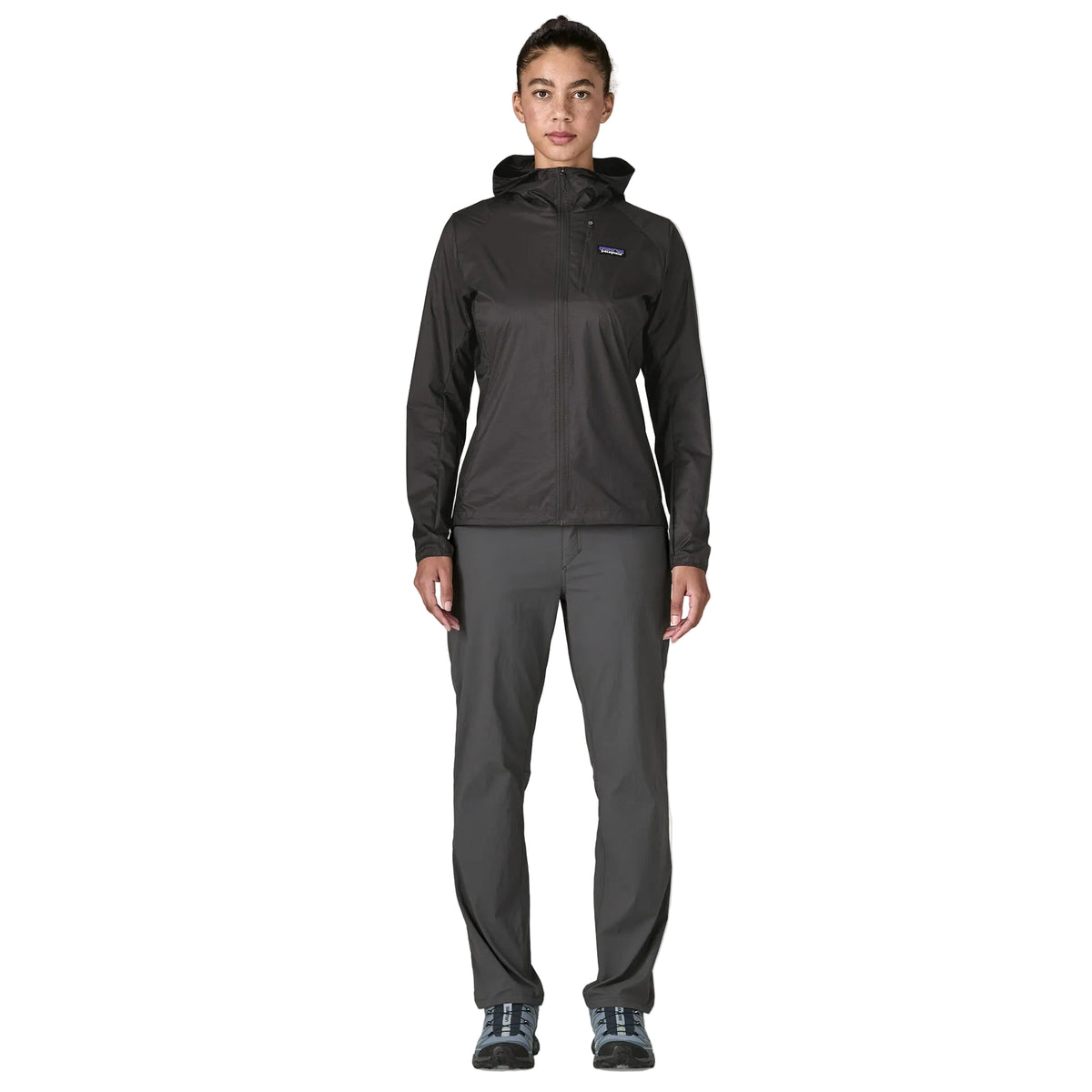 Patagonia Women's Houdini in Black w/Black lightweight windbreaker jacket made from recycled nylon ripstop with adjustable hood, zippered chest pocket and reflective P-6 logo.