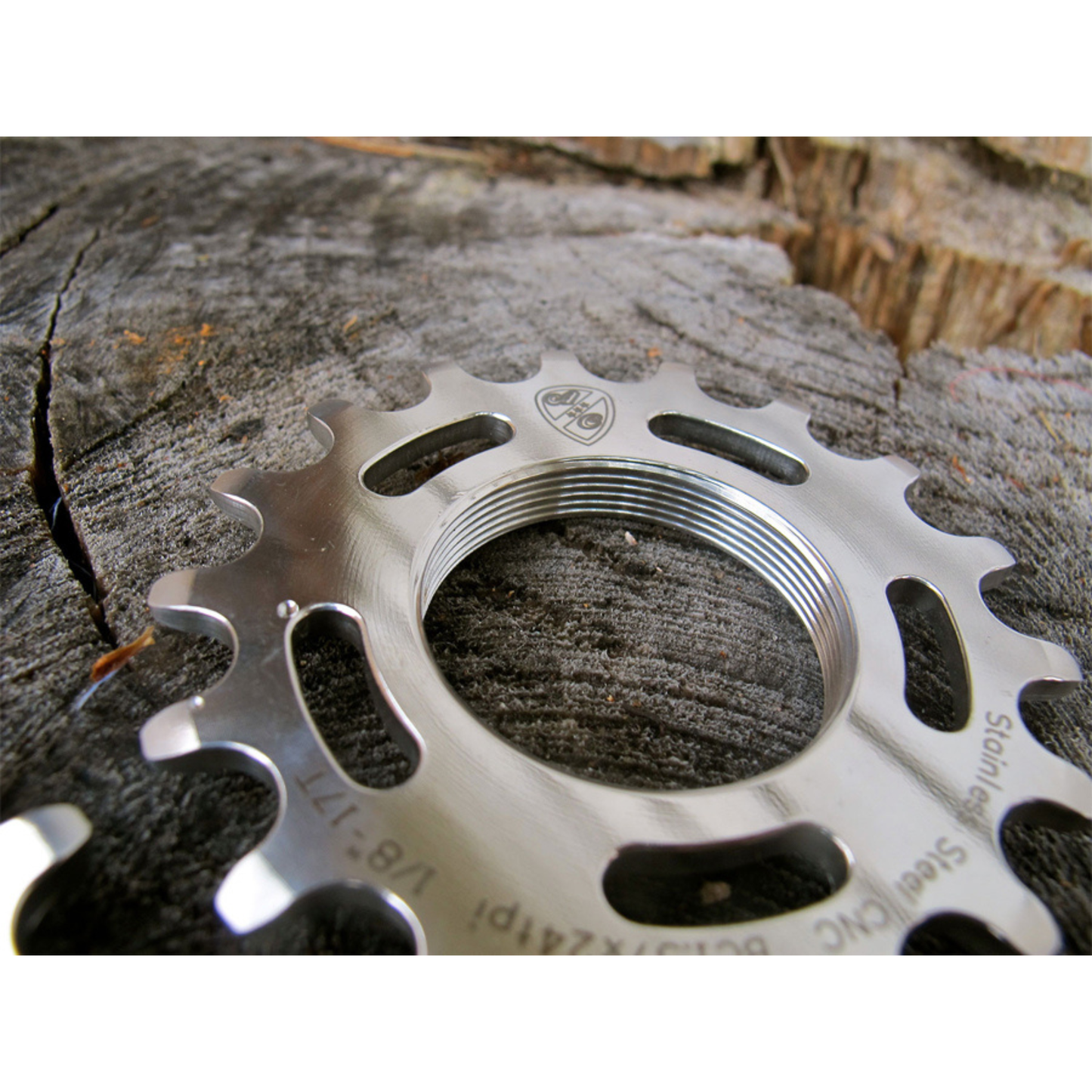 All-City stainless steel fixed-gear cog close-up