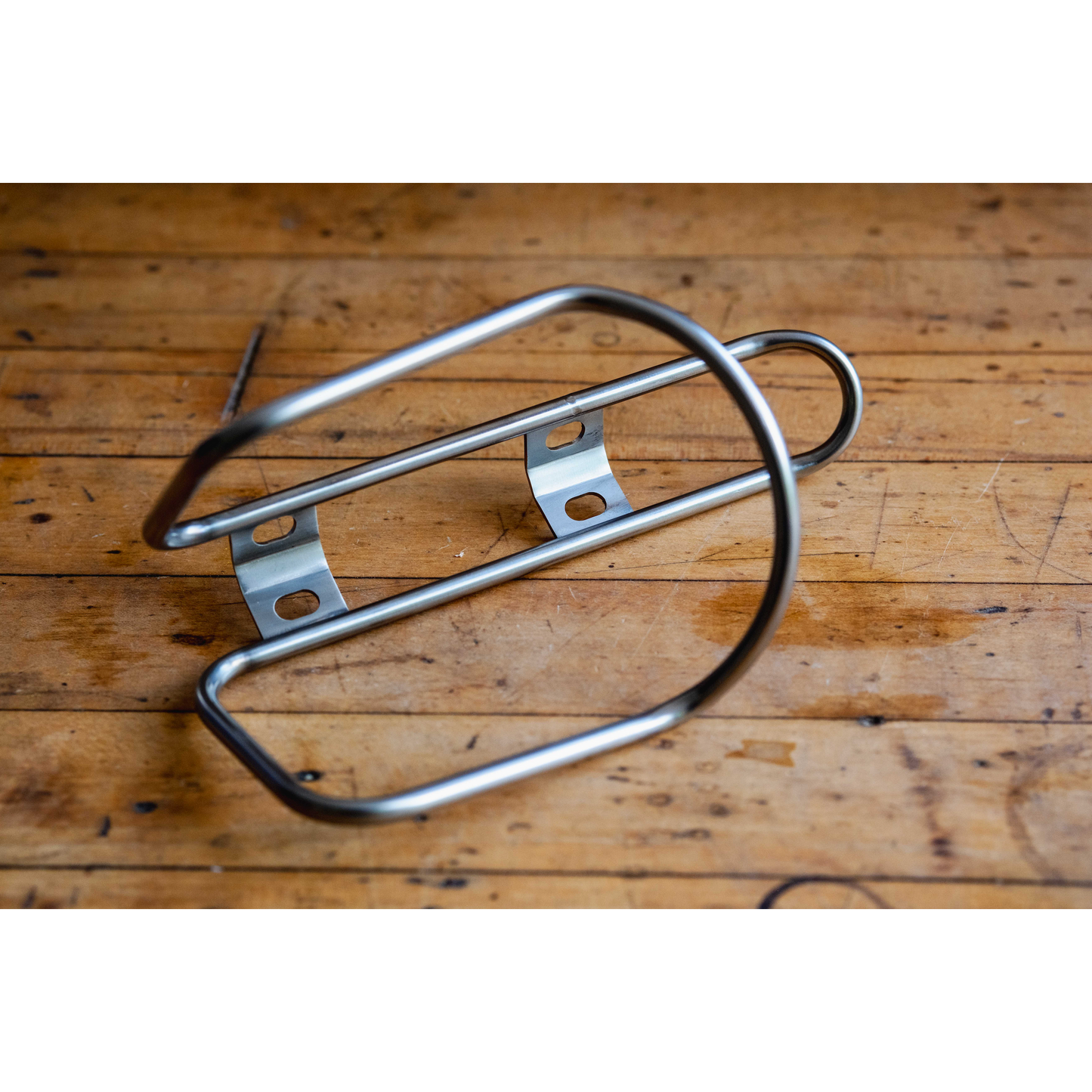 King Cage Stainless Side Loader Cage on wood floor