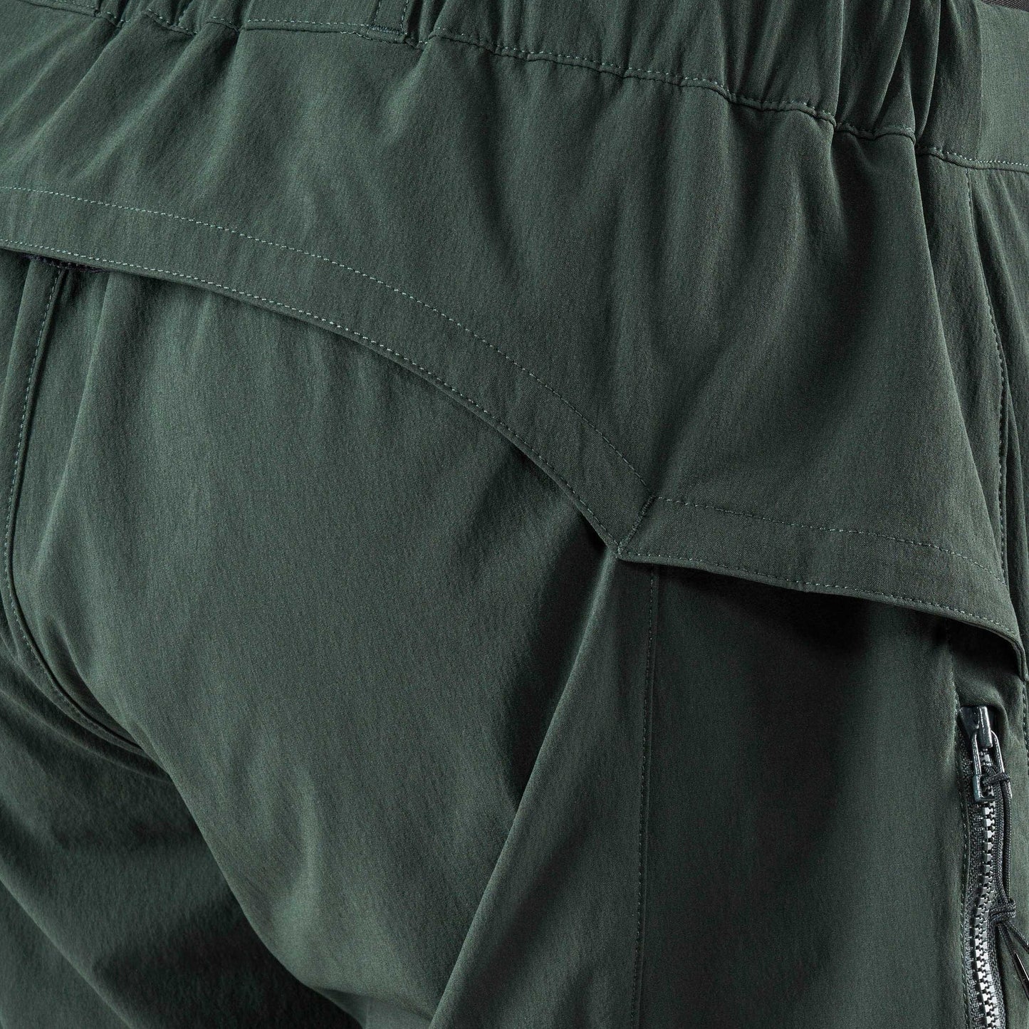 Close up detail of dark green PeDaLED Yuma Trail Pants for trail riding, bikepacking and adventure cycling