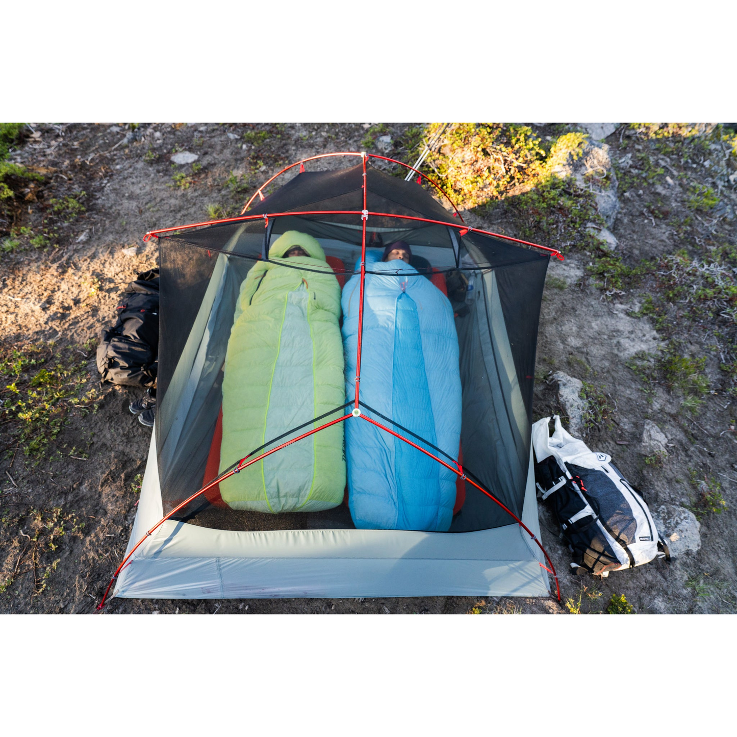 MSR Hubba Hubba LT 2‑Person Tent with two people in sleeping bags inside the tent