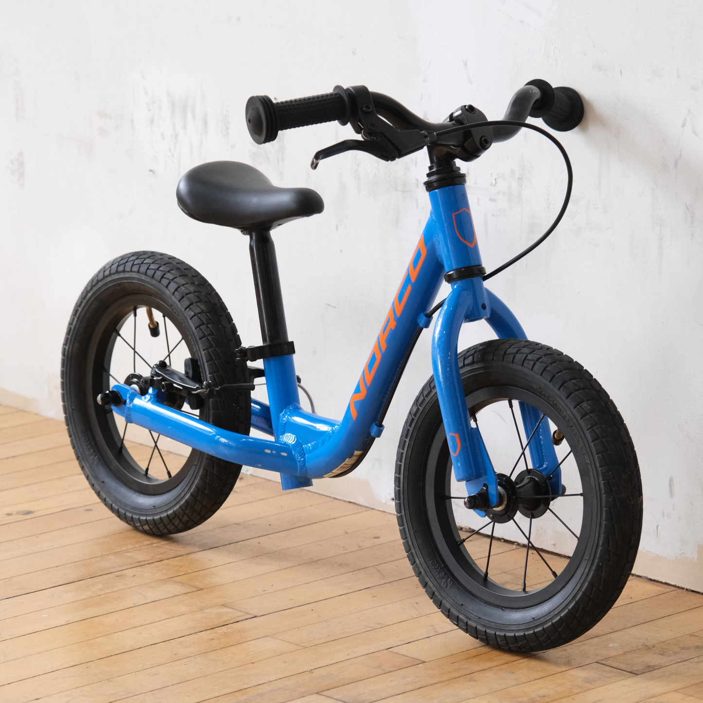 Norco Runner 12 Blue balance bike front side view