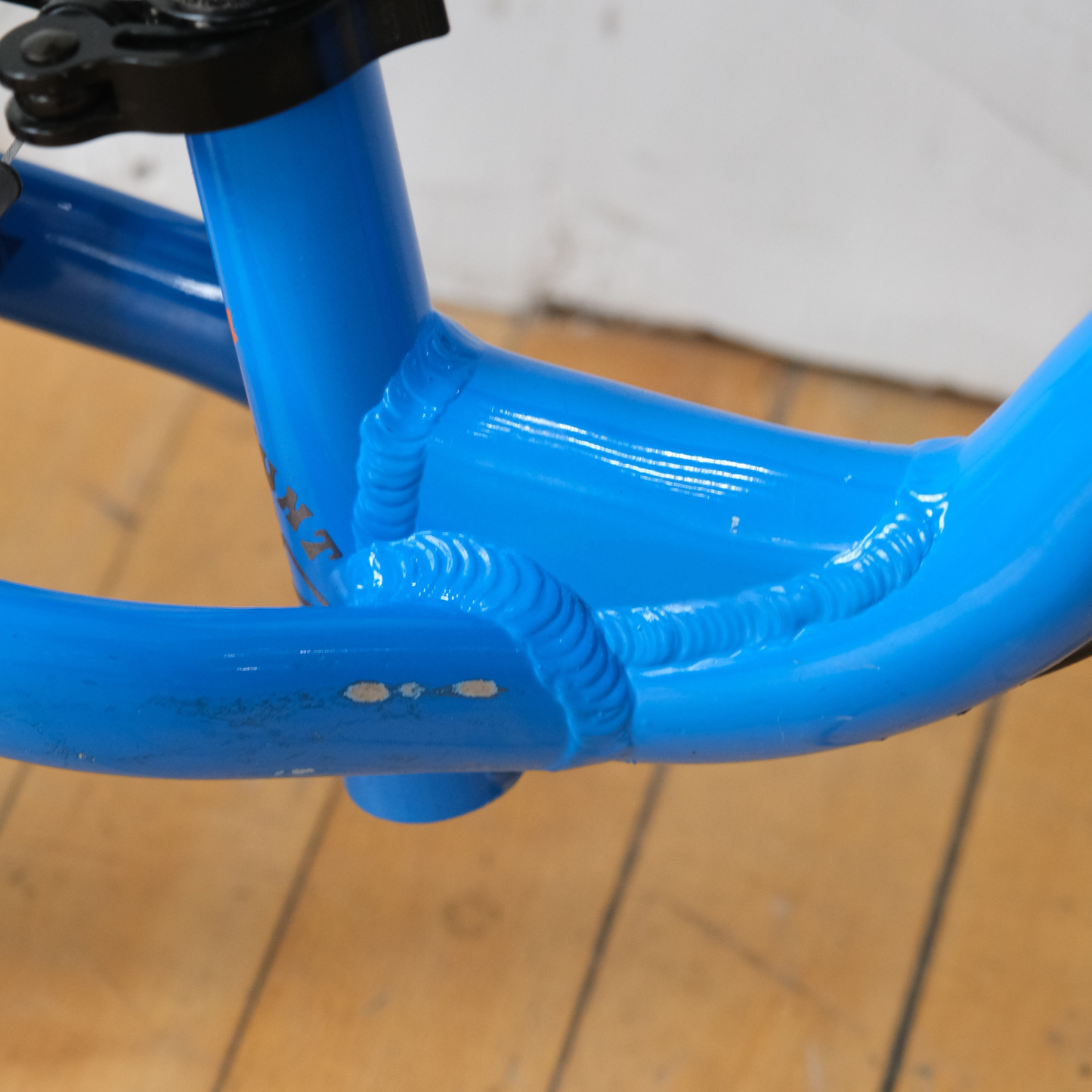 Norco Runner 12 Blue balance bike down tube view