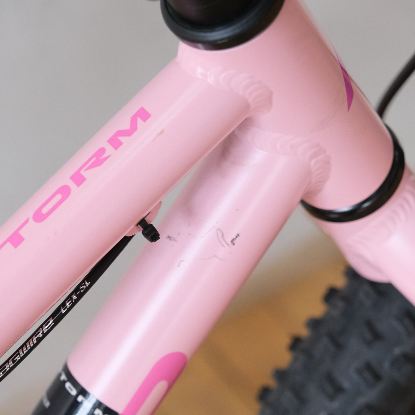 Norco Storm 20 Disc Pink Purple Trade-In youth top tube view