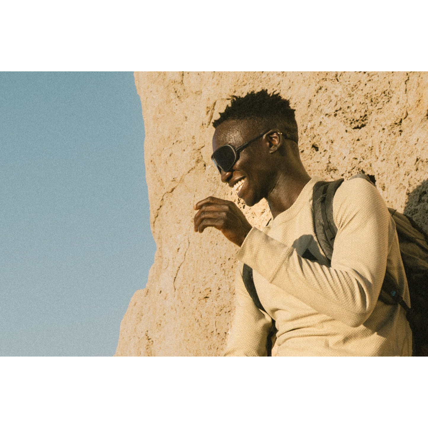 Person wearing Ombraz Refugio armless sunglasses outdoors