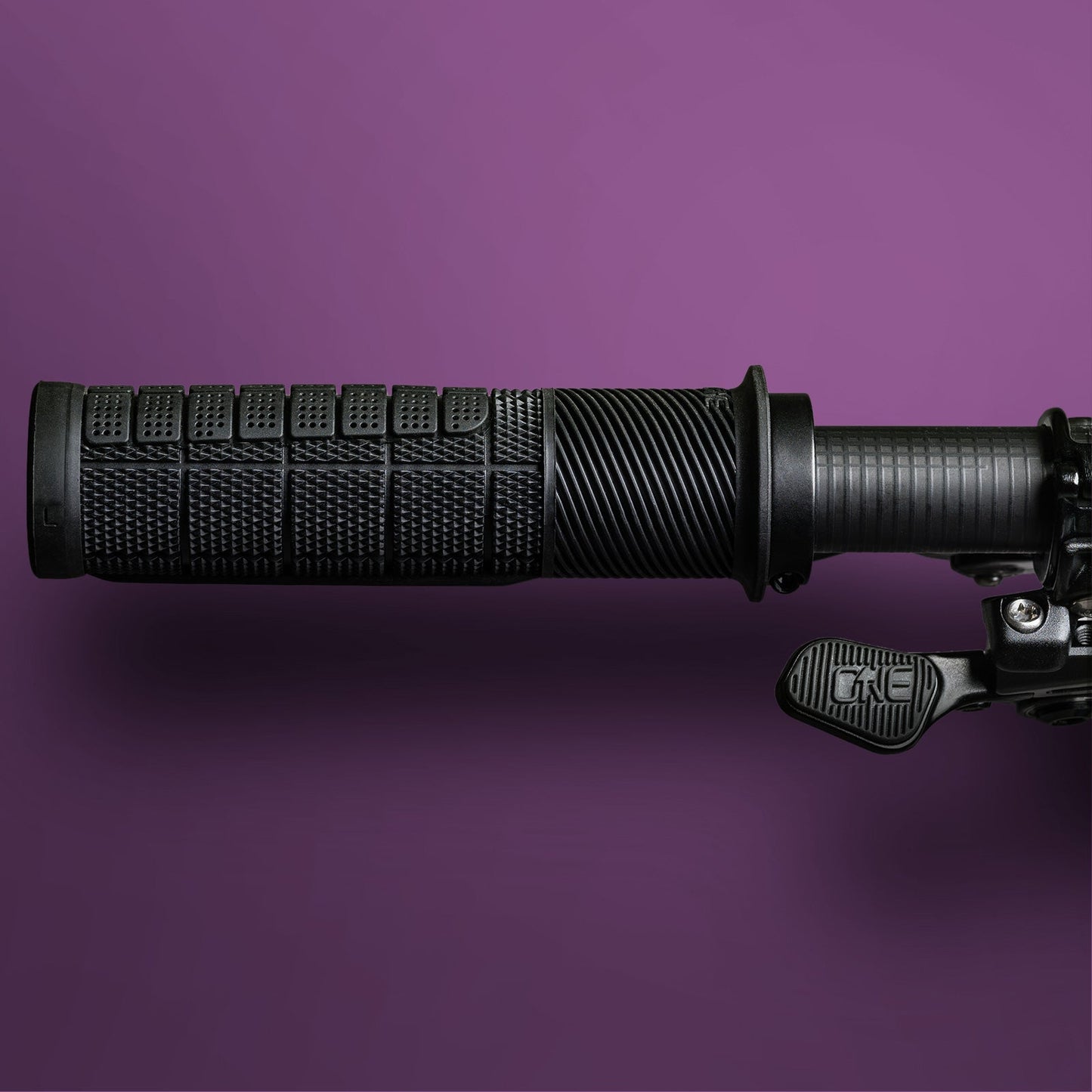 OneUp Thick Grip Black installed on handlebar