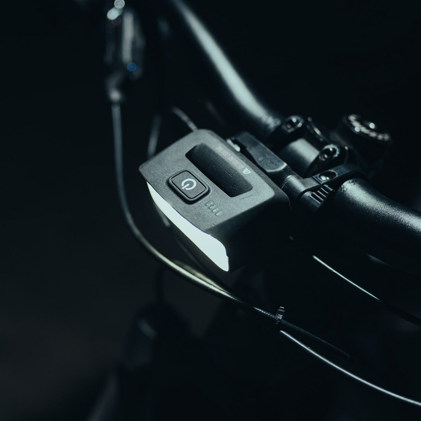 Outbound Lighting Trail Evo handlebar light mounted to a bar