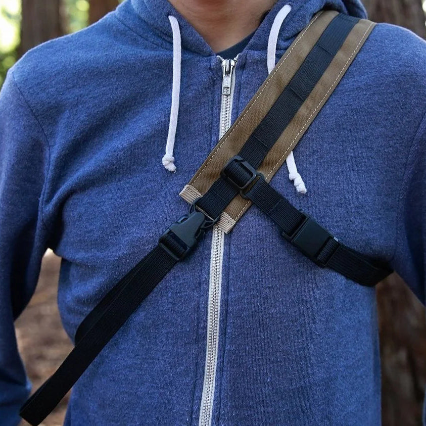 Outer Shell camera strap in use around a person's chest