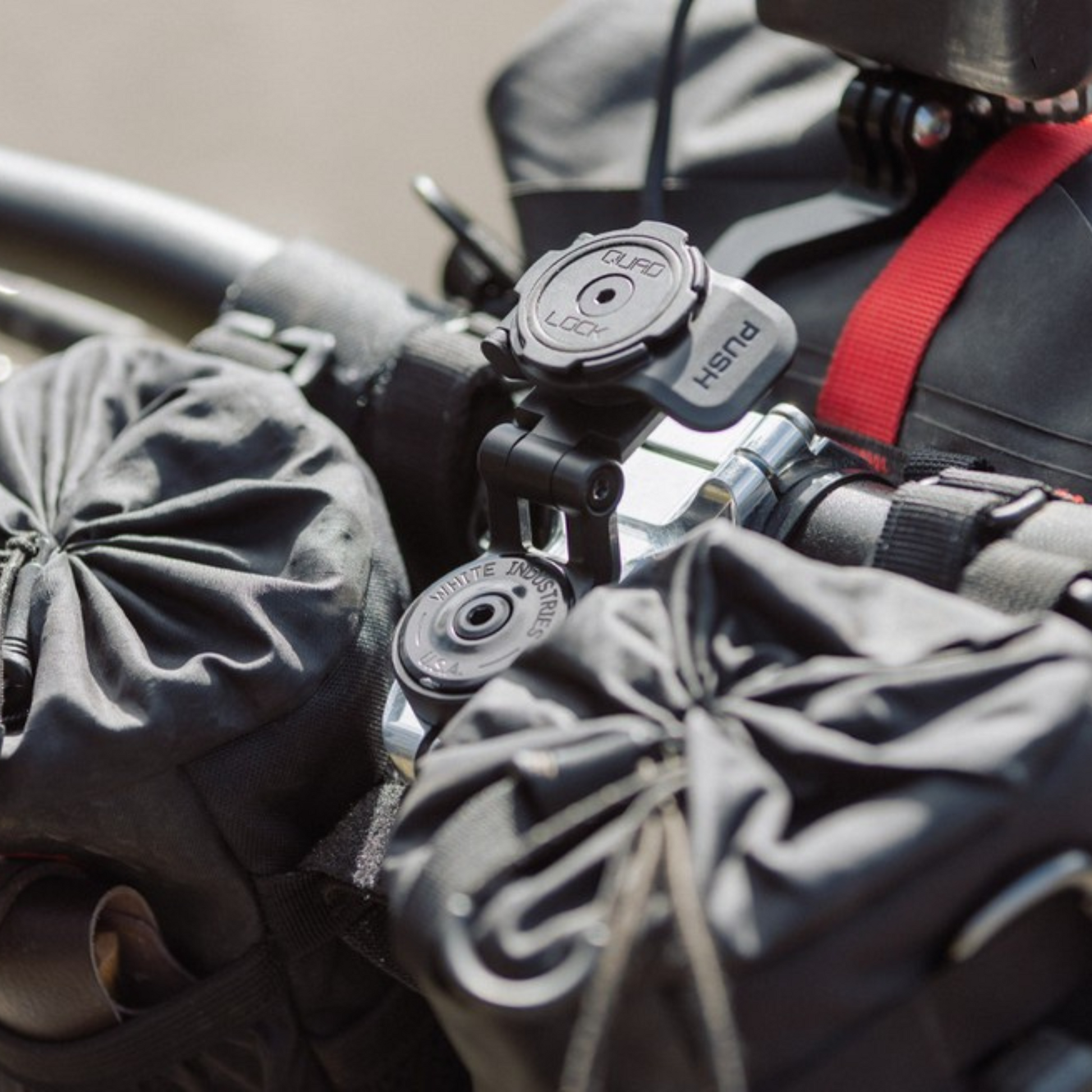 Quad Lock Adjustable Stem Cap Mount on stem, dual-stage twist-lock, adjustable hinge in upper position