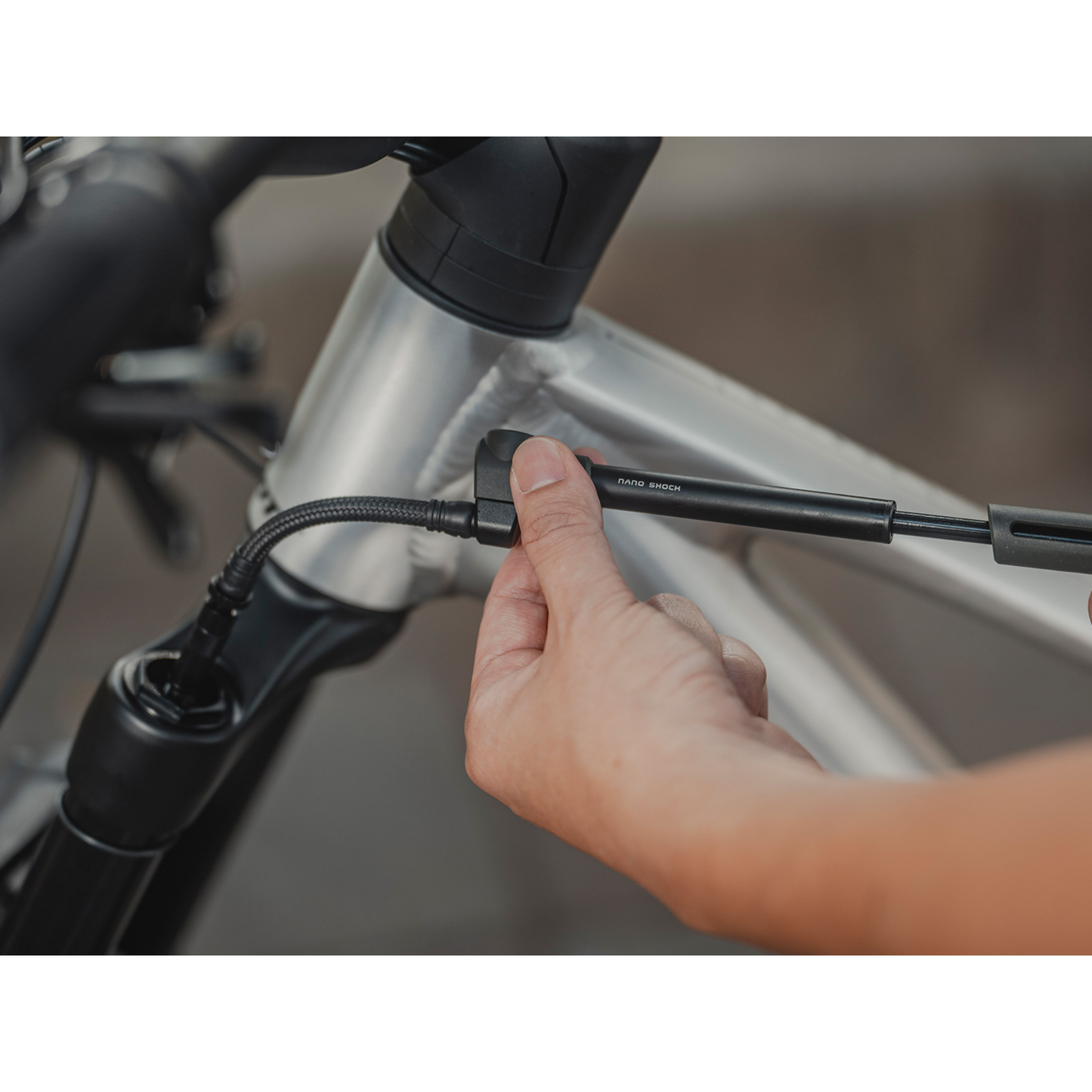Topeak Nano Shock Pump with 360° rotatable braided hose inflating suspension fork