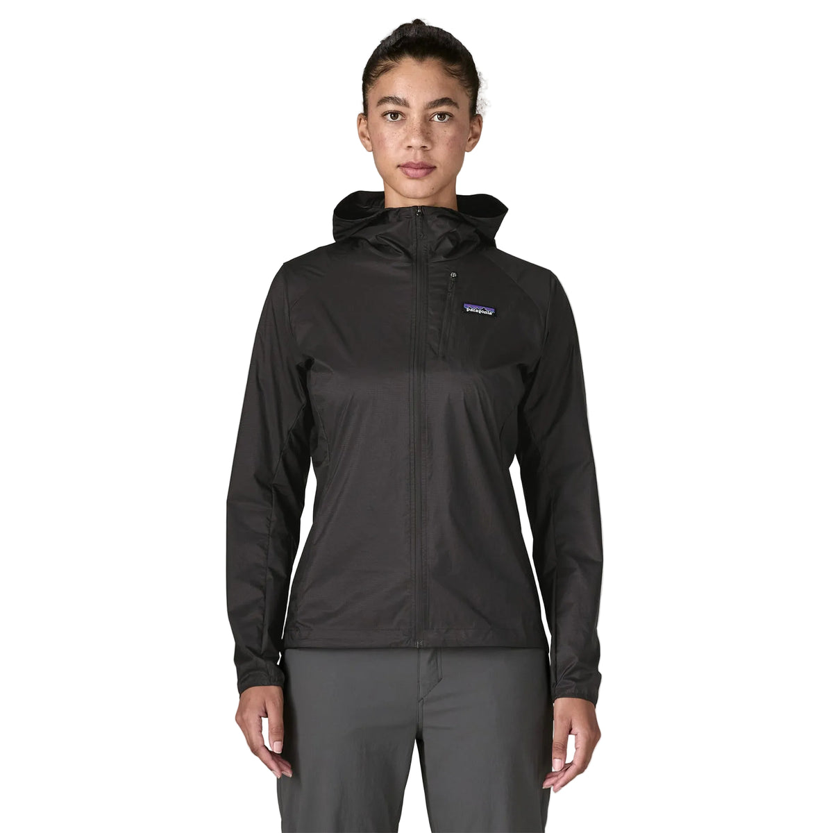 Patagonia Women's Houdini in Black w/Black lightweight windbreaker jacket made from recycled nylon ripstop with adjustable hood, zippered chest pocket and reflective P-6 logo.