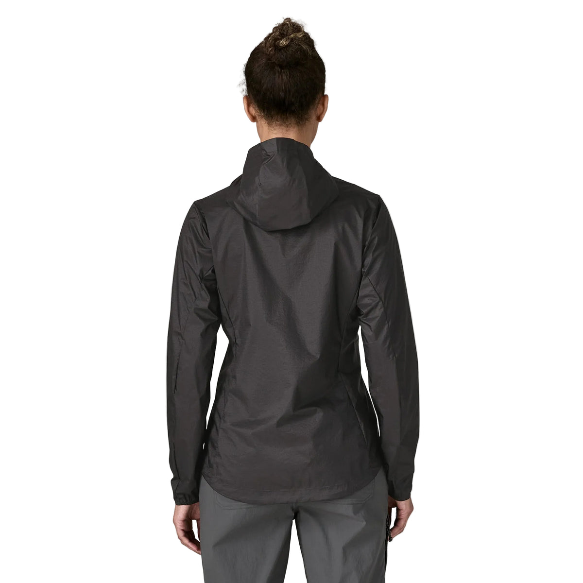 Patagonia Women's Houdini in Black w/Black lightweight windbreaker jacket made from recycled nylon ripstop with adjustable hood, zippered chest pocket and reflective P-6 logo.