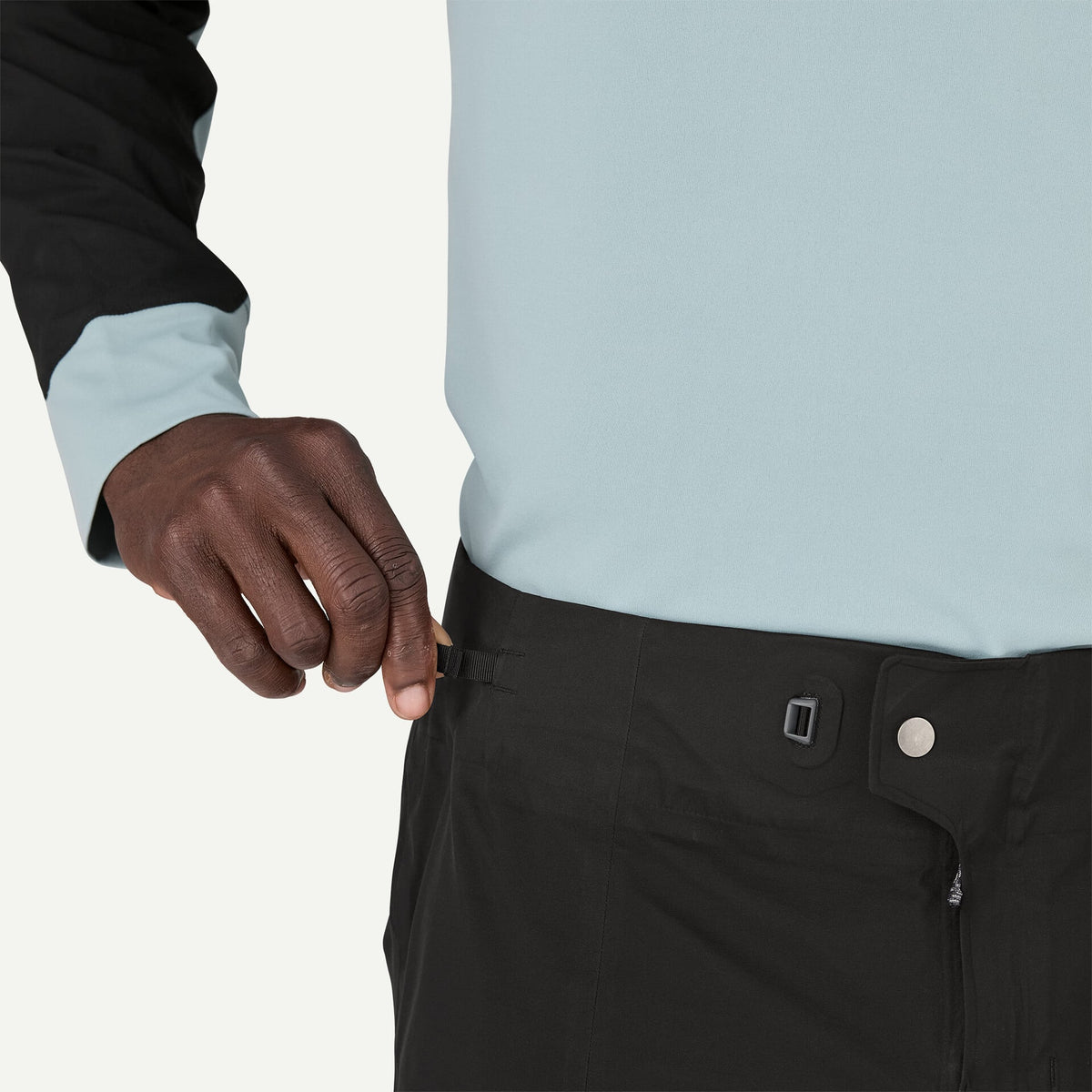 Patagonia Men's Dirt Roamer Storm waterproof mountain bike pants with reinforced knees, adjustable OppoSet® waistband, zippered thigh pockets and leg openings.