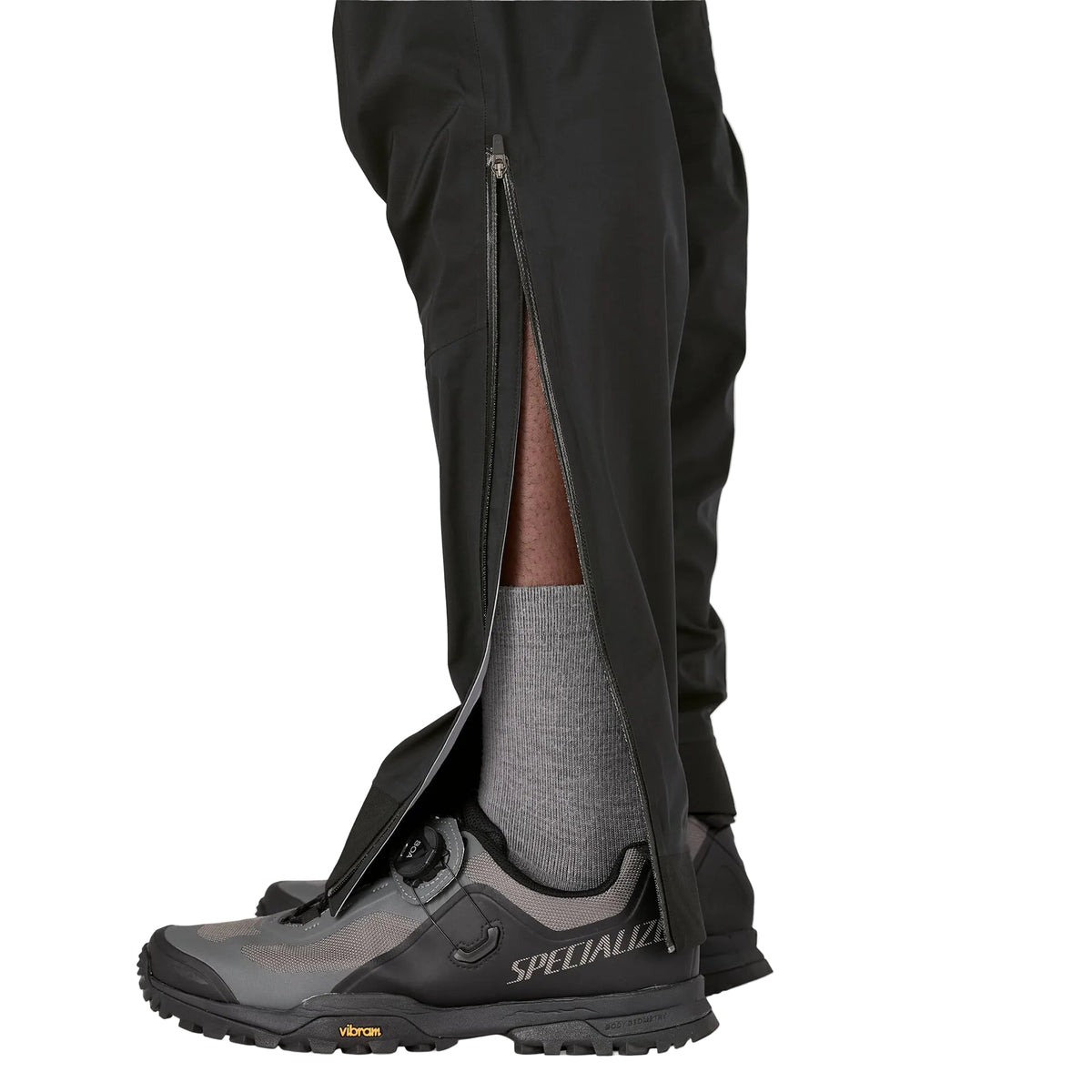 Patagonia Men's Dirt Roamer Storm waterproof mountain bike pants with reinforced knees, adjustable OppoSet® waistband, zippered thigh pockets and leg openings.