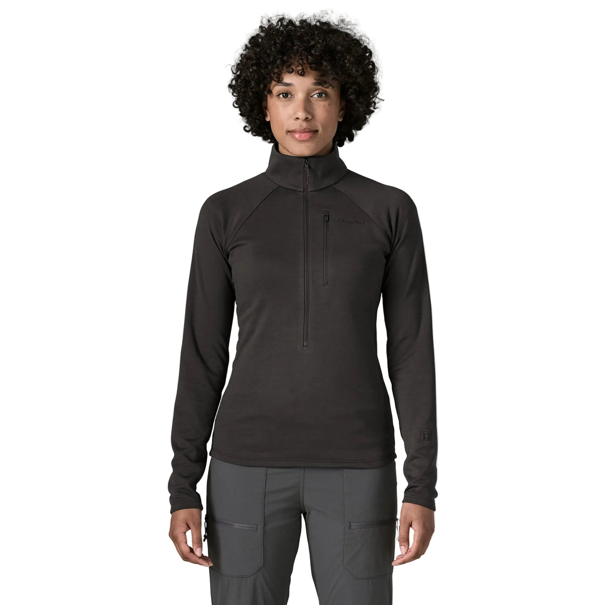 Patagonia Women's R1 Ultralight 1/2-Zip Pullover featuring lightweight recycled polyester double-knit fabric, deep front zipper and vertical zippered chest pocket.