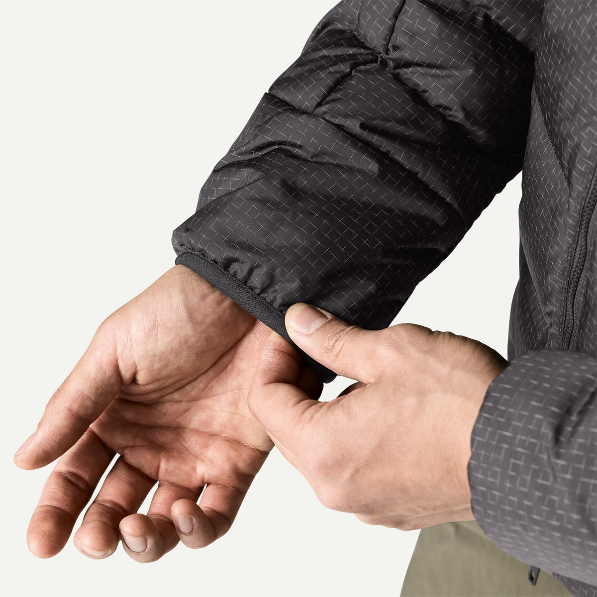 Patagonia Men's Durable Down Hoody featuring abrasion-resistant ripstop fabric, insulated adjustable hood, full-length zipper and quilted down construction.