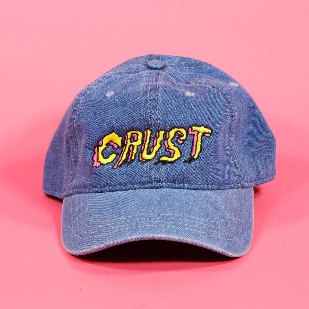 Crust Bikes adjustable ball cap with embroidered Crust logo on the front and adjustable strap closure at the back.