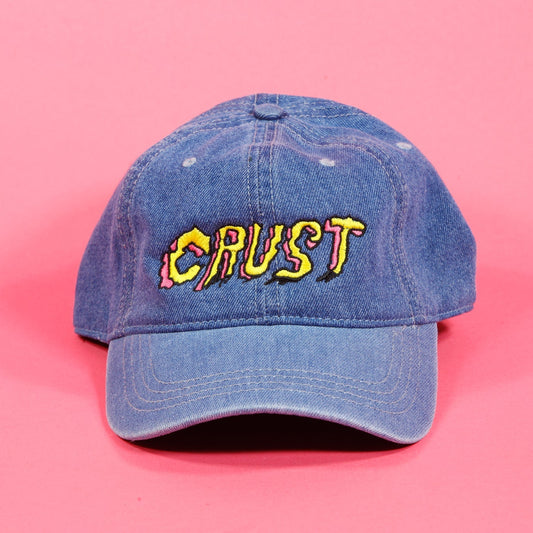 Crust Bikes adjustable ball cap with embroidered Crust logo on the front and adjustable strap closure at the back.