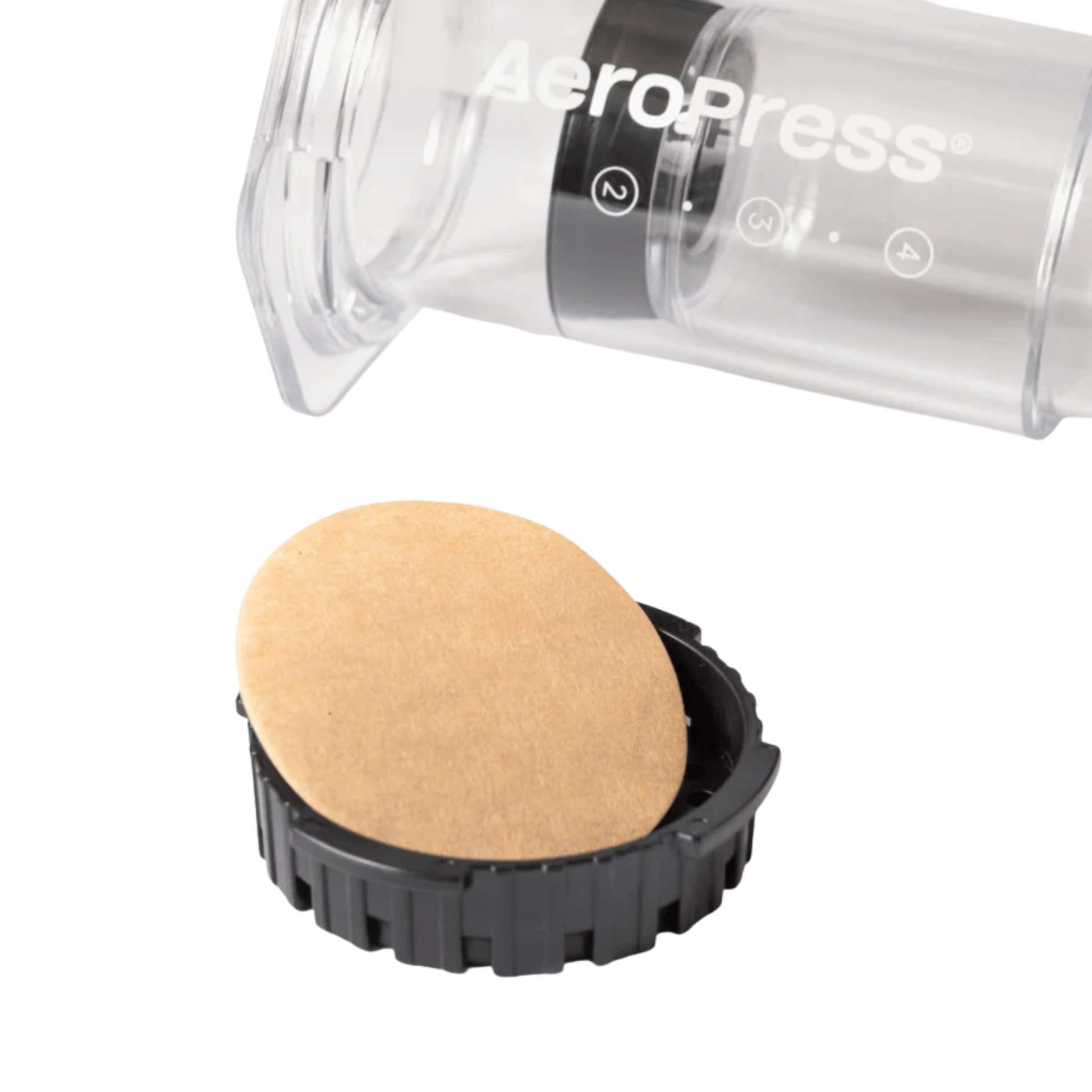 AeroPress natural paper micro filters being installed in the coffee maker 