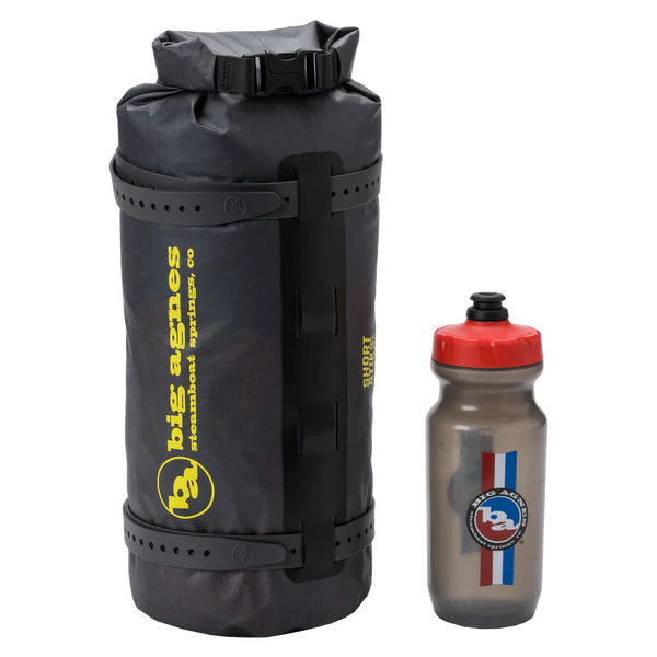 Big Agnes Tiger Wall UL2 Bikepack two person ultralight bikepacking tent packed an sitting next to a water bottle for size reference