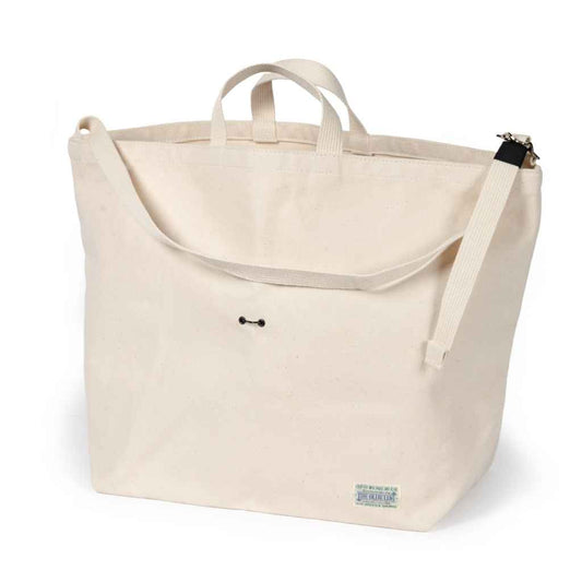 Blue Lug 137 Tote Bag designed for Wald 137 bicycle baskets, featuring a drawcord closure and adjustable shoulder strap, available in assorted fabrics.