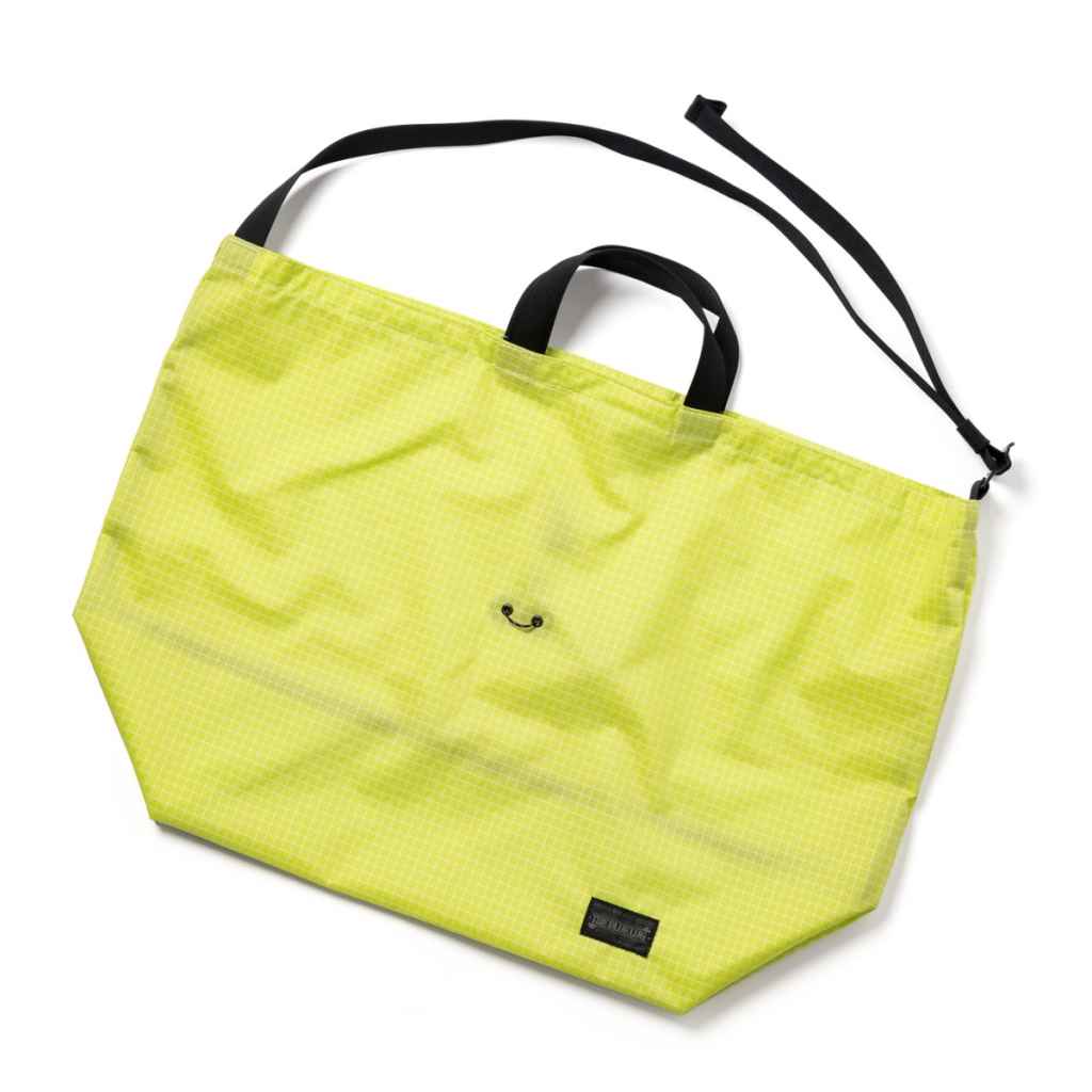 Blue Lug 137 Tote Bag designed for Wald 137 bicycle baskets, featuring a drawcord closure and adjustable shoulder strap, available in assorted fabrics.