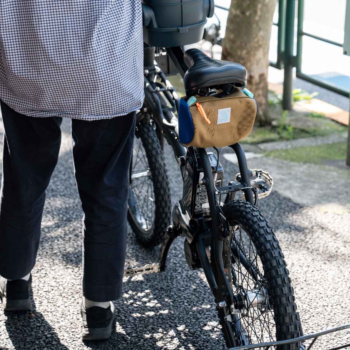 Blue Lug Handlebar Pouch featuring a compact, soft-sided nylon construction with removable straps for mounting to bicycle handlebars.