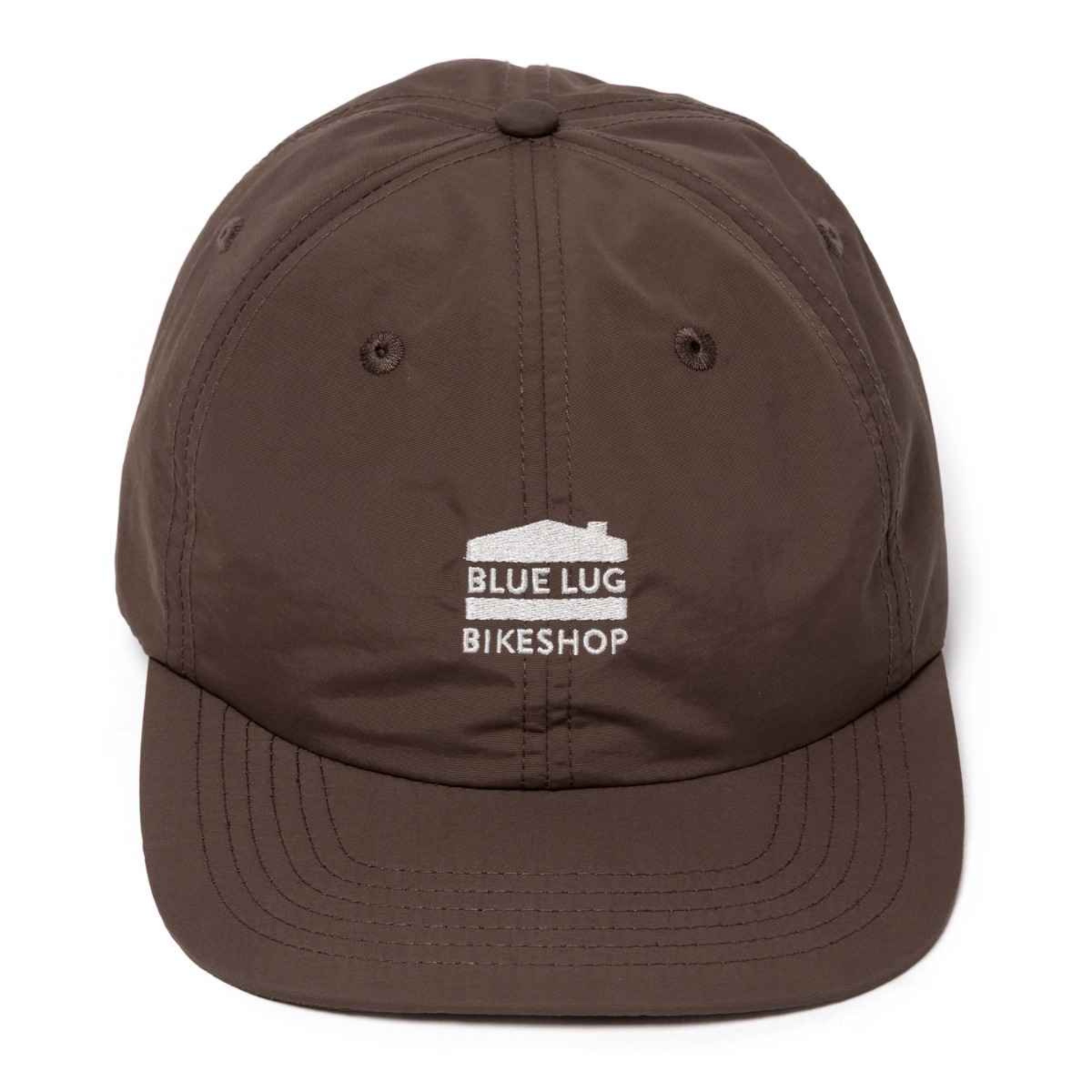 A dark brown 5-panel baseball cap with a white embroidered logo on the front that reads 'BLUE LUG BIKESHOP' with a small house graphic, shown against a plain white background.