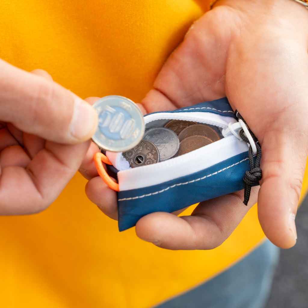 Blue Lug Kozeni Pouch, a compact Japanese-made coin and accessory pouch available in assorted technical fabrics and printed designs.