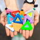 Blue Lug Mini Triangle Reflectors in assorted colours being held in hands