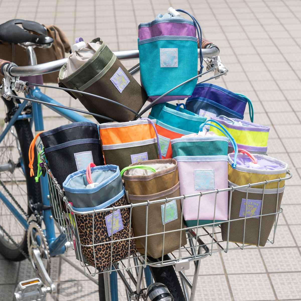 Blue Lug Stem Pouch mounted on handlebar. Designed for carrying essentials by bike. Available Canada wide.