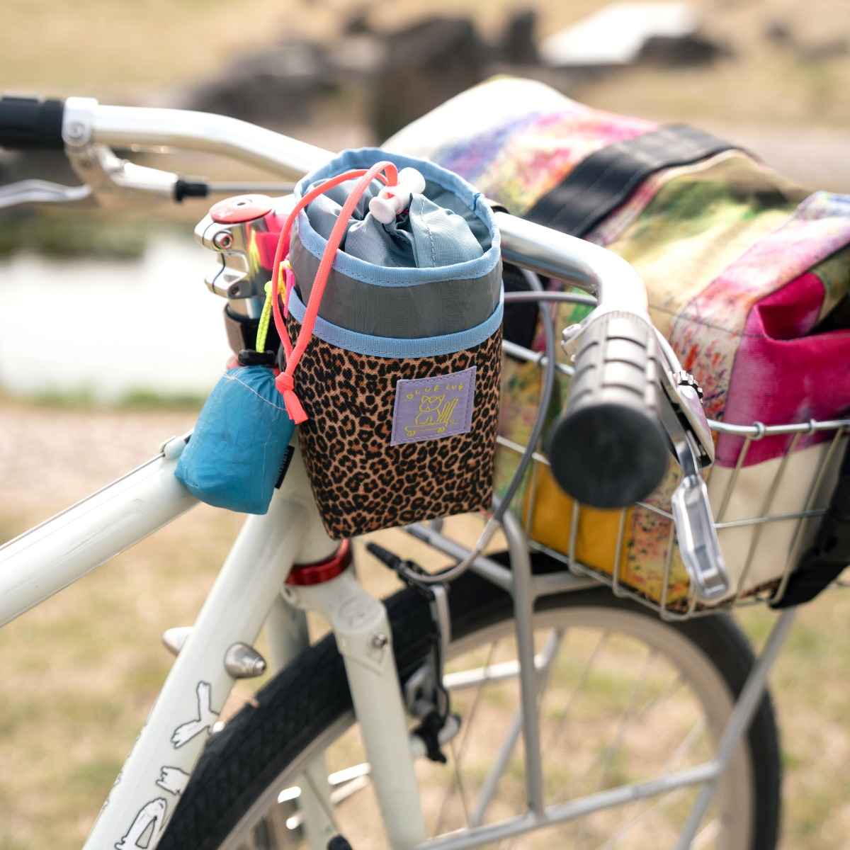Blue Lug Stem Pouch mounted on handlebar. Designed for carrying essentials by bike. Available Canada wide.