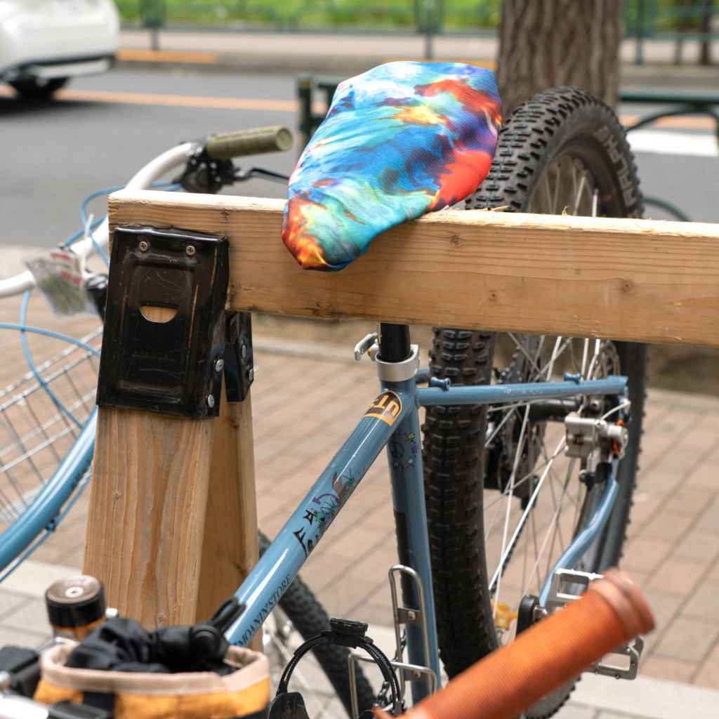 Blue Lug Saddle Cover in Tiedye designed for protecting bicycle saddles from the elements. Waterproof, packable and easy to stow.