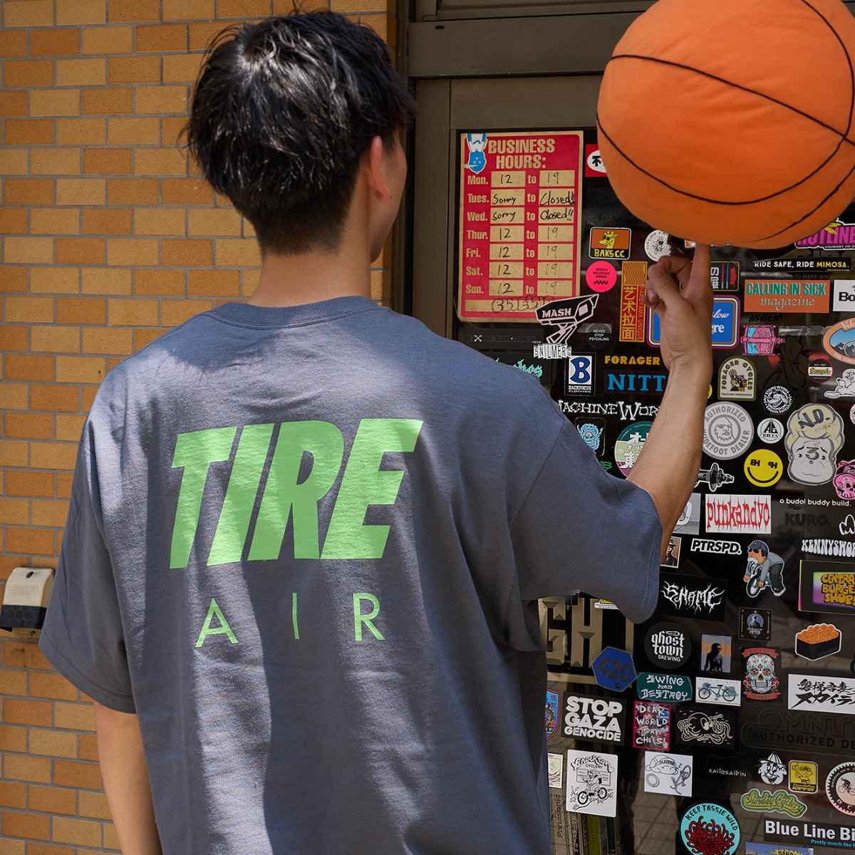 Detail of back side of Blue Lug Tire Air T-Shirt in Charcoal with Tire Air graphic text.  Available in Toronto, Canada.