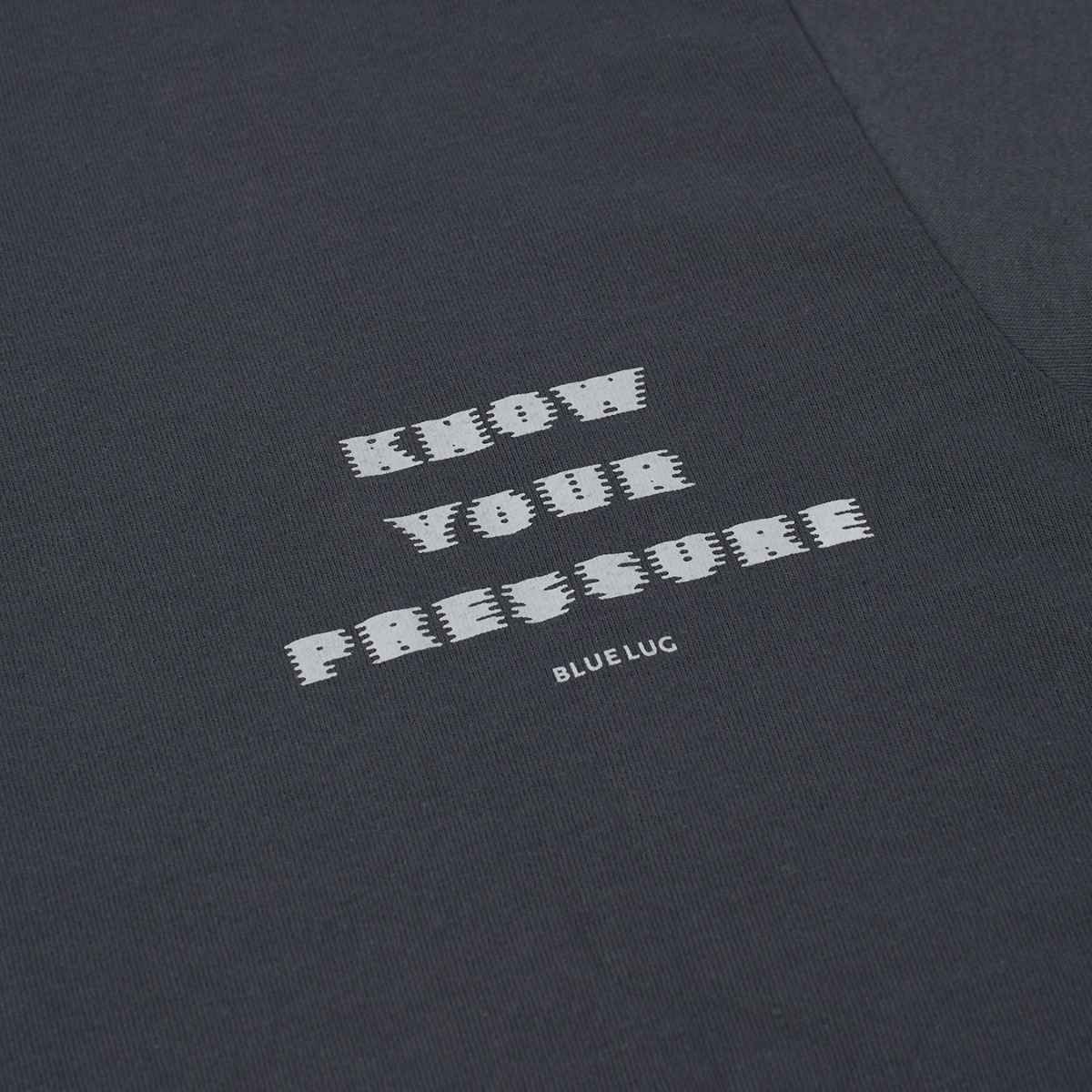 Detail of front side of Blue Lug Tire Air T-Shirt in Charcoal with Know Your Pressure graphic text.  Available in Toronto, Canada.