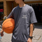 Detail of front side of Blue Lug Tire Air T-Shirt in Charcoal with Tire Air graphic text.  Available in Toronto, Canada.