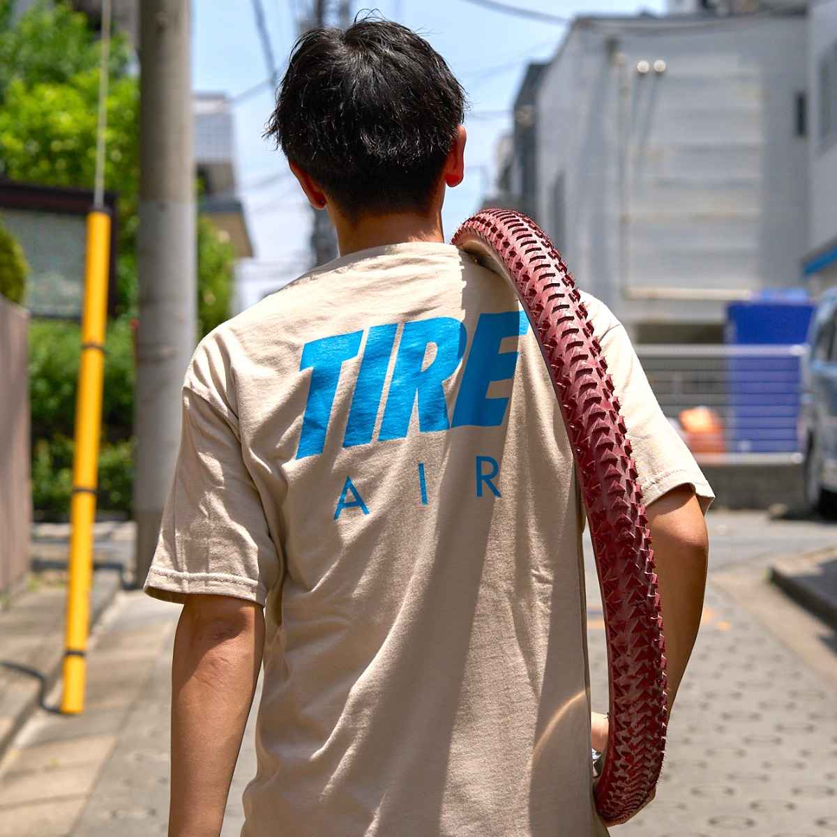 Blue Lug Tire Air T-Shirt in sand with front graphic.