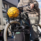 Blue Lug X-Strap elastic cargo strap in holding a ball in a basket on bicycle