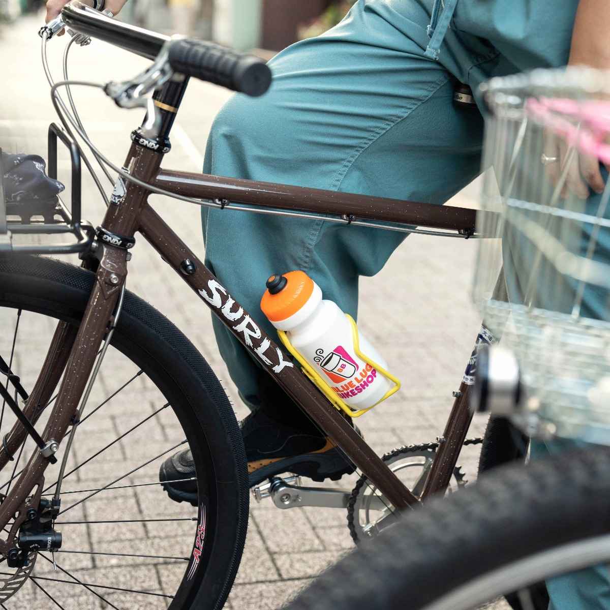 Blue Lug Coffee Water Bottle with coffee shop inspired logo with coffee cup in white. 22oz Specialist Purist bottle.