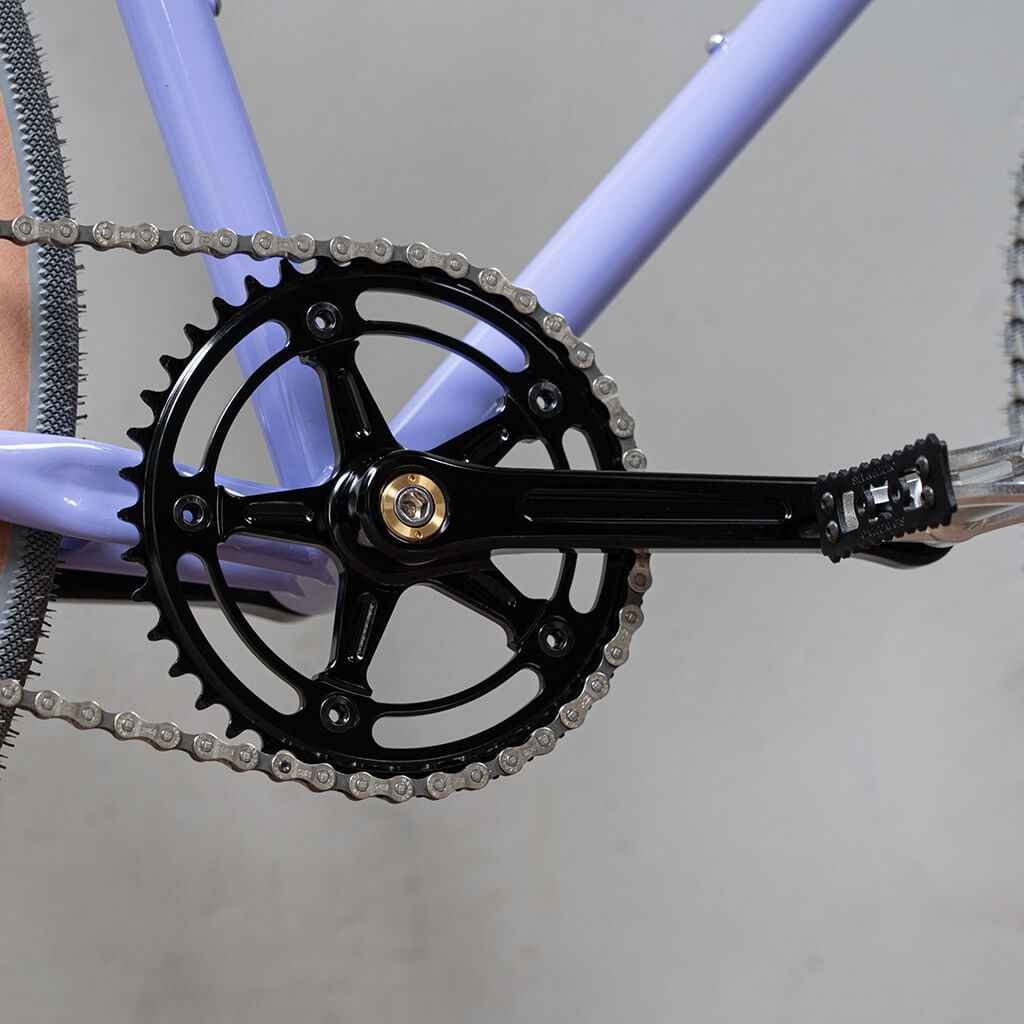 Blue Lug RMC Track Crank Set in all black with slim crank arms and hollow 46T chainring for single-speed track bikes.