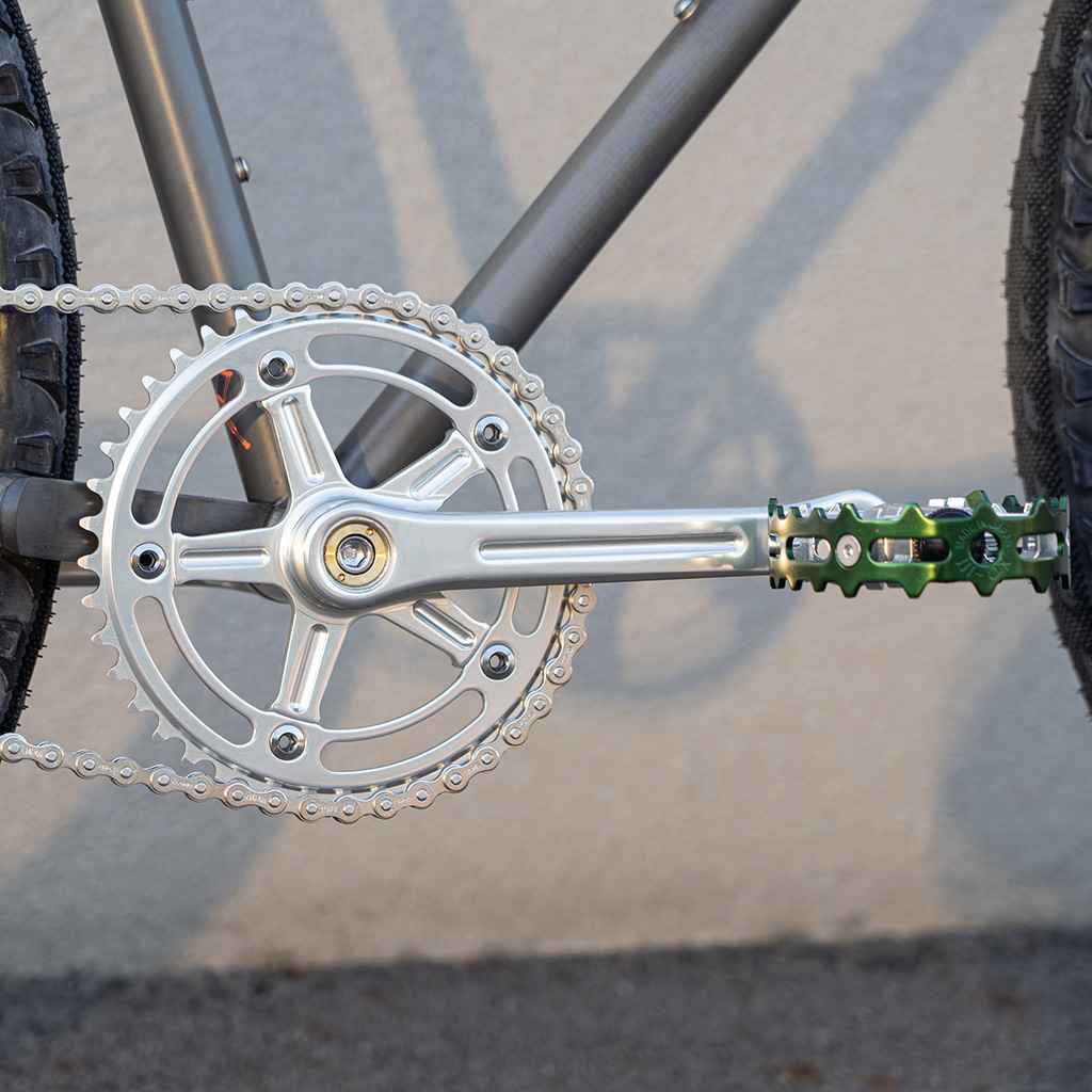 Blue Lug RMC Track Crank Set in all silver with slim crank arms and hollow 46T chainring for single-speed track bikes.