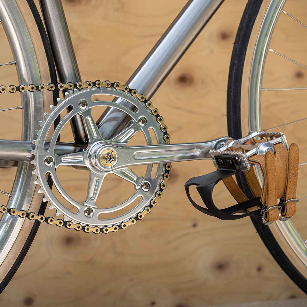 Blue Lug RMC Track Crank Set in all silver with slim crank arms and hollow 46T chainring for single-speed track bikes.