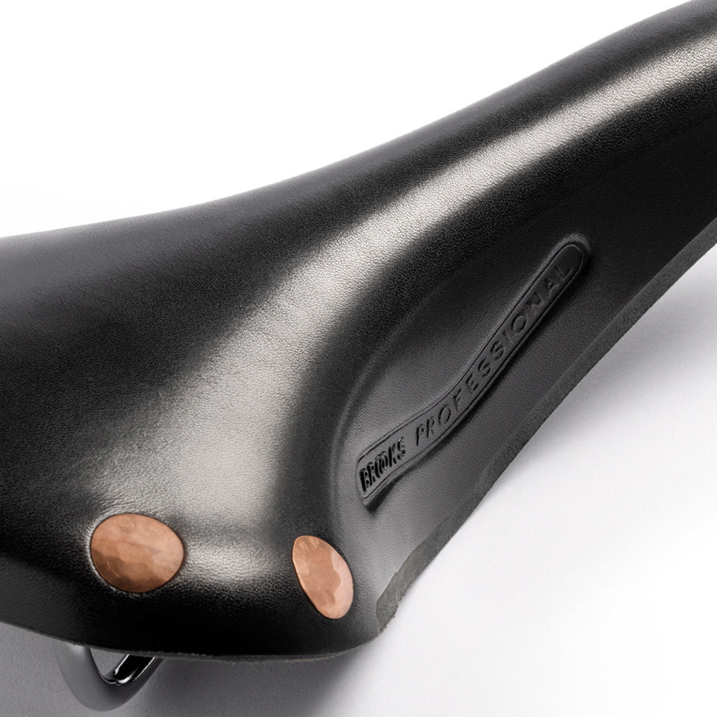 Detailed view of the copper rivets on the Brooks Team Pro Special Saddle copper rivets