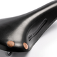 Close up of Brooks Team Pro Special Short handcrafted leather bicycle saddle with copper rivets.