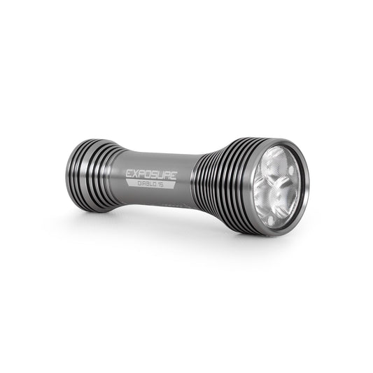 Exposure Lights Diablo 15 rechargeable 2000-lumen bicycle helmet light with gunmetal grey CNC-machined aluminium body and adjustable action camera-compatible helmet mount.