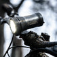 Exposure Lights MaXx-D 17 rechargeable front bicycle light with gunmetal grey CNC-machined aluminium body, 4850-lumen REFLEX output and colour OLED display.