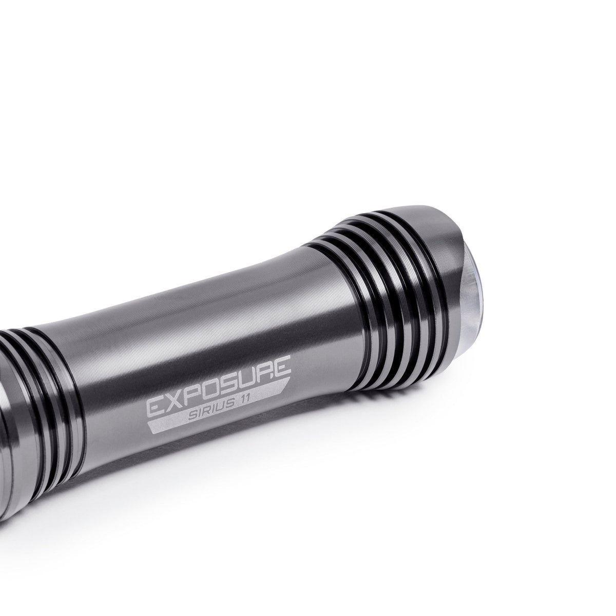 Exposure Lights Sirius 11 rechargeable front bicycle light with gunmetal grey CNC-machined aluminium body, 1300-lumen output and USB-C charging.
