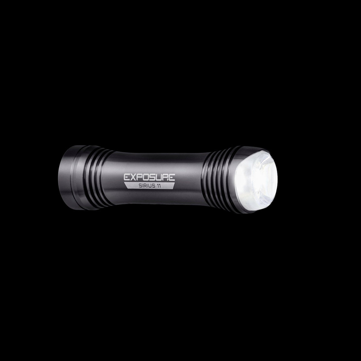 Exposure Lights Sirius 11 rechargeable front bicycle light with gunmetal grey CNC-machined aluminium body, 1300-lumen output and USB-C charging.