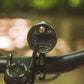 Exposure Lights Toro 16 rechargeable front bicycle light with gunmetal grey CNC-machined aluminium body, 3850-lumen output, colour OLED display and REFLEX 2.0 technology.