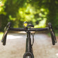Exposure Lights Toro 16 rechargeable front bicycle light with gunmetal grey CNC-machined aluminium body, 3850-lumen output, colour OLED display and REFLEX 2.0 technology.